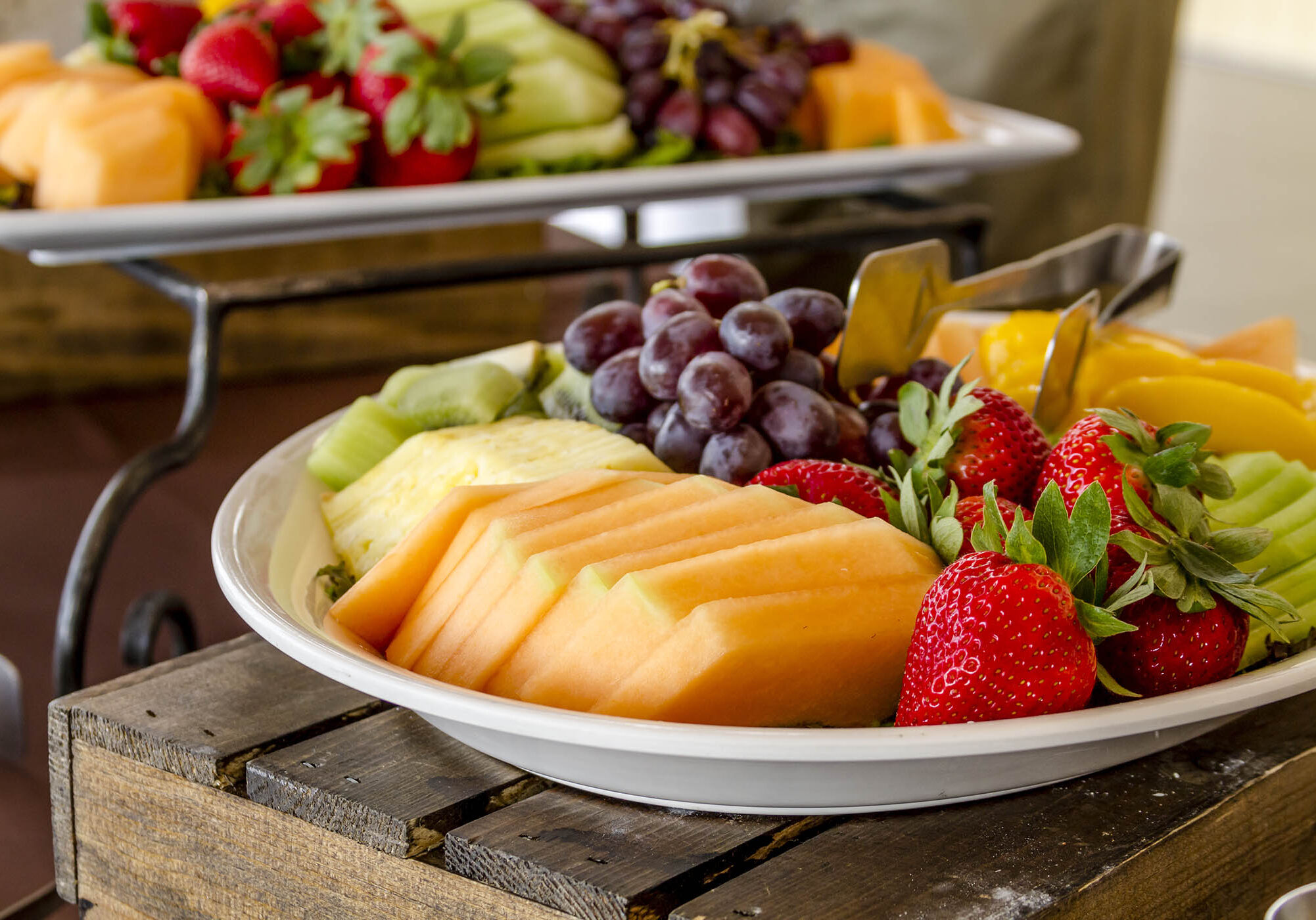 Tray of assorted fruit at catered event